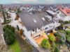 Attraktives Reihenendhaus als Generationenhaus – mit schönem Garten und umfangreichen Modernisierungen - Luftbildaufnahme Gartenseite